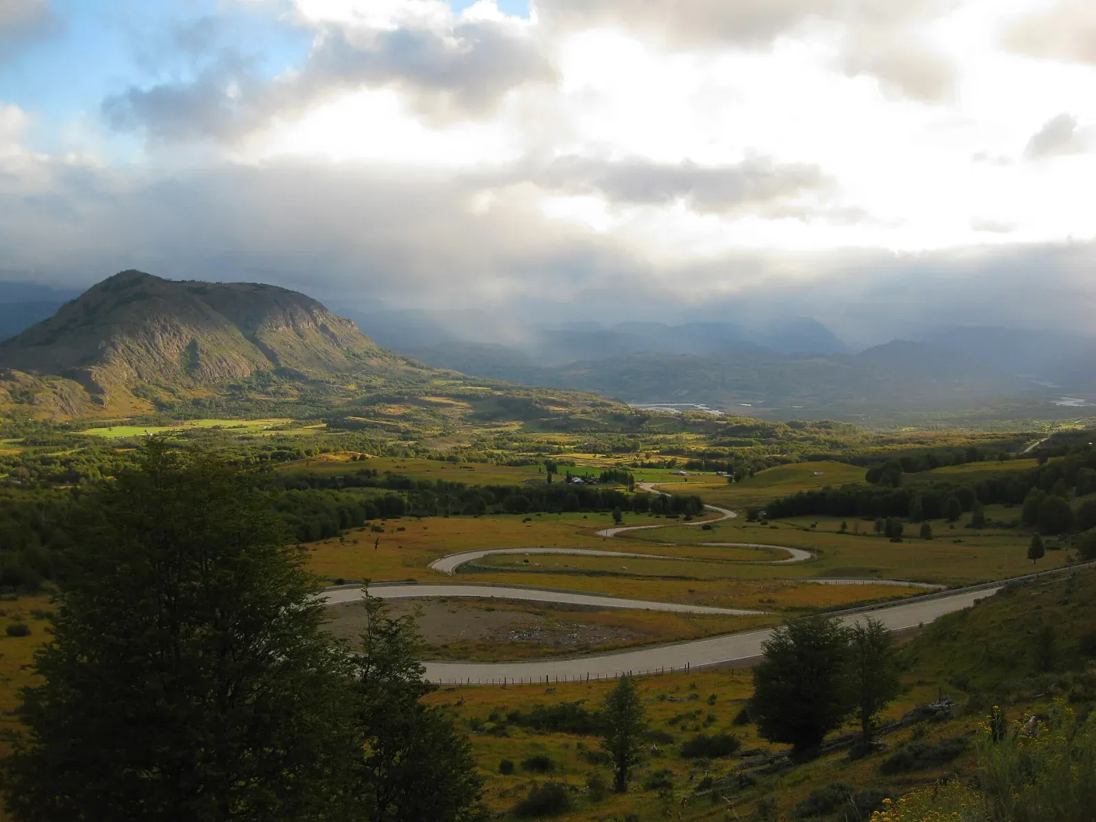 Chile's Carretera Austral winding through a broad Patagonian mountain valley